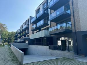 a building with balconies on the side of it at Apartament Morzlive in Ustronie Morskie