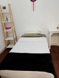 Ένα ή περισσότερα κρεβάτια σε δωμάτιο στο Mi casa