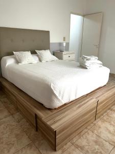 Ένα ή περισσότερα κρεβάτια σε δωμάτιο στο El Rincón en Lobos