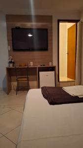 Postel nebo postele na pokoji v ubytování Hotel Vitoria