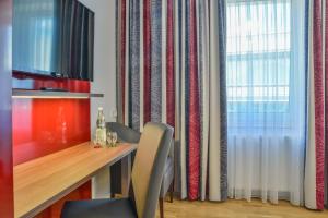 TV a/nebo společenská místnost v ubytování City Hotel Wetzlar