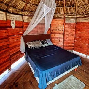 Ένα ή περισσότερα κρεβάτια σε δωμάτιο στο Casa Balam Sisal