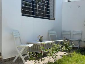 a table and chairs sitting next to a building at Chalet villa QUE POUR LES FAMILLES in Imouzzer Kandar +54 photos