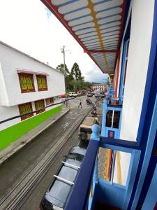 a view from a train window of a street at Hotel Colibri Real in Filandia +23 photos