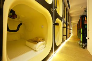 a room with a bed in the middle of a hallway at ACE Hostel in Hanoi