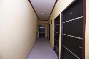 a hallway of a room with a closet and a door at Hotel O Prime Stayzz in Kaliānpur