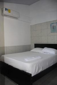 Ένα ή περισσότερα κρεβάτια σε δωμάτιο στο Costa Linda Art Hostel