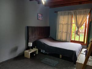 Ένα ή περισσότερα κρεβάτια σε δωμάτιο στο Casa en miramar temporada