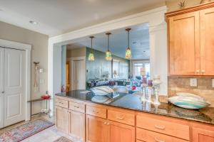 a kitchen with a sink and a large mirror at Sunsets at the Shoreline in Newport +99 photos