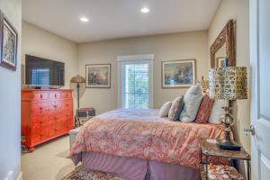a bedroom with a large bed and a dresser at Sunsets at the Shoreline in Newport