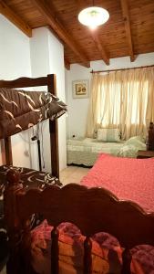 a bedroom with two bunk beds and a ceiling at Casa sonia in San Rafael