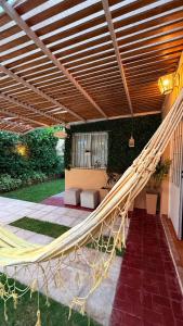 a hammock in the middle of a patio at Casa sonia in San Rafael