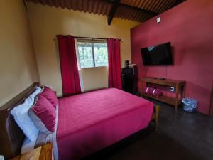 Una cama o camas en una habitación de Casa Morada