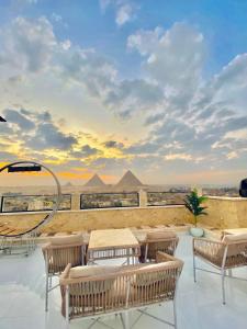 a view of the pyramids from the roof of a building at pyramids fort & free pick up shuttel in Cairo +28 photos