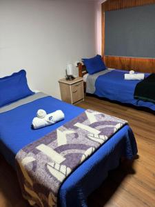 Ένα ή περισσότερα κρεβάτια σε δωμάτιο στο Hotel Gran Luna