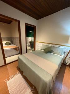 Ένα ή περισσότερα κρεβάτια σε δωμάτιο στο Recanto Bellagio