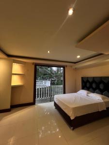 Ένα ή περισσότερα κρεβάτια σε δωμάτιο στο Castillo Yarinacocha