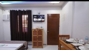 Μια τηλεόραση ή/και κέντρο ψυχαγωγίας στο Sea Garden Suites