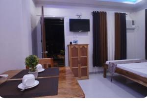 Ένα ή περισσότερα κρεβάτια σε δωμάτιο στο Sea Garden Suites