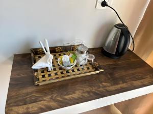 a table with a tray of food and a lamp at Teplong The Paix, Kaziranga National Park in Sakmuthi