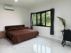 Кровать или кровати в номере Q Residence