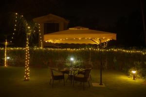 Φωτογραφία από το άλμπουμ του Aravali Farm Gurgaon, 3 Bedroom Villa with Lawn Barbeque Grill and Pool σε Γκουργκάον