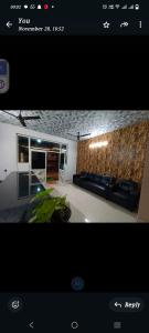 ein Bild von einem Wohnzimmer mit einem Sofa in der Unterkunft Hs honey valley resort's in Araku