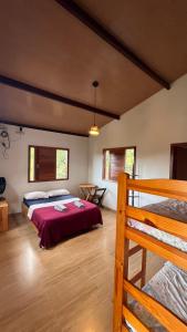 En eller flere senge i et værelse på Casa Mirante dos Muricis Vale do Capão