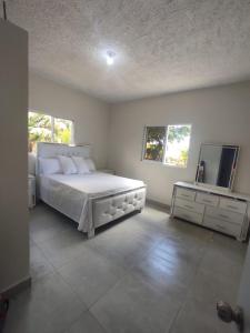 Ένα ή περισσότερα κρεβάτια σε δωμάτιο στο Hermosa casa de campo