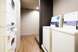 Eldhús eða eldhúskrókur á HOTEL MYSTAYS Kanda