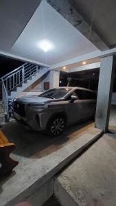a car is parked in a parking garage at Uno's Crib - Pilar in Pilar +1 photo