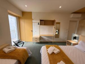 Giường trong phòng chung tại Etra House