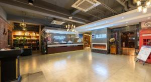 Lounge nebo bar v ubytování James Joyce Coffetel Beijing Yizhuang Development Zone Chicheng Times Square