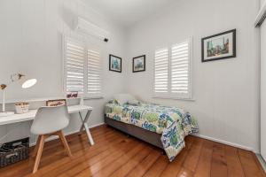 Ένα ή περισσότερα κρεβάτια σε δωμάτιο στο Spacious and Charming Queenslander in Ipswich