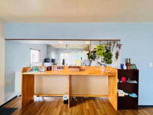 a kitchen with a large wooden counter top at アイランズステーション in Setouchi