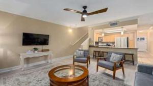 a living room with a couch and a ceiling fan at Beautiful 3 Bedroom Villa in Honokai Hale