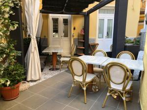 an outdoor patio with a table and chairs at Affittacamere Monterosso 5 Terre in Monterosso al Mare