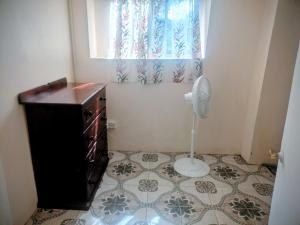 a small bathroom with a window and a floor at BtC Apartments St Paul's in Saint Paulʼs +18 photos