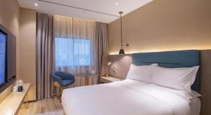 TV a/nebo společenská místnost v ubytování ZMAX Hotels Shenzhen Lianhuacun Metro Station