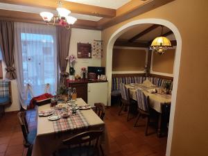 a dining room with tables and chairs and a room with at Privatzimmer Pendl in Abtenau +56 photos