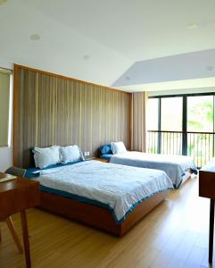 Giường trong phòng chung tại MT Luxury Villas Phú Quốc