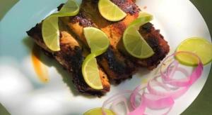 a white plate with a piece of food with lime slices at La Isla Bonita in Guraidhoo