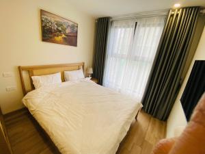 En eller flere senge i et værelse på velvet rose home