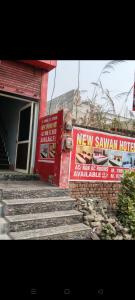 Et logo, certifikat, skilt eller en pris der bliver vist frem på NEW Sawan HOTEL