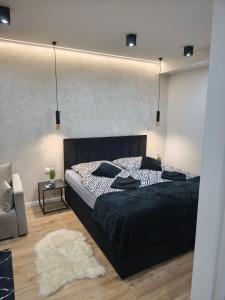 Postel nebo postele na pokoji v ubytování Belvárosi Lux Apartman 2