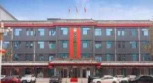 a large building with cars parked in front of it at GreenTree Inn Express Hebei Shijiazhuang Zhengding County Changshan Dong Road in Zhengding
