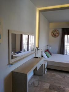 Postel nebo postele na pokoji v ubytování Attalos Apartments