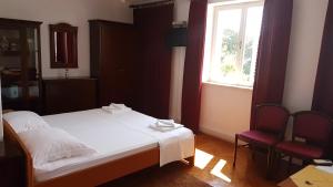 Ein Bett oder Betten in einem Zimmer der Unterkunft Rooms Vjera