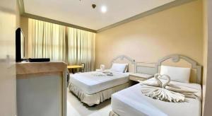 Ένα ή περισσότερα κρεβάτια σε δωμάτιο στο Cebu Northwinds Hotel +143 φωτογραφίες