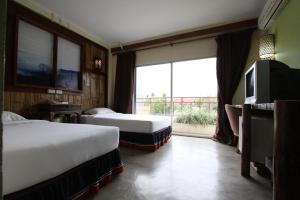 TV a/nebo společenská místnost v ubytování Phumanee Home Hotel